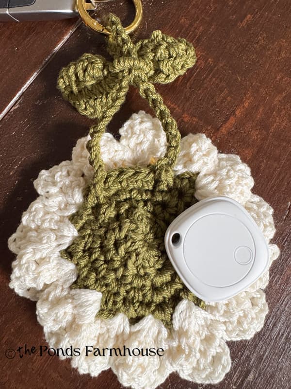 Use purse charm key ring to hold AirTag