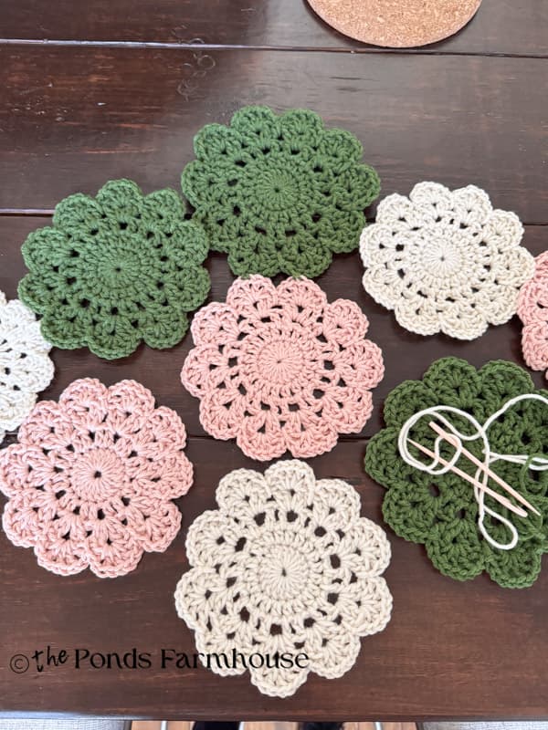 Arrange doilies in the pattern you desire and use large needle and yarn to stitch together