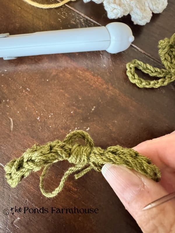 Create a loop on back of leaf at center