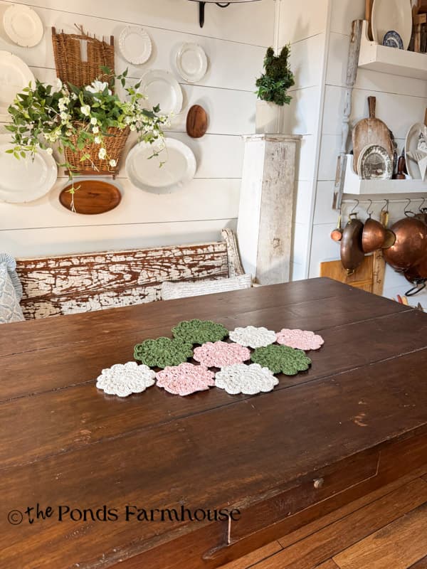hand crochet doily table runner on rustic farmhouse table