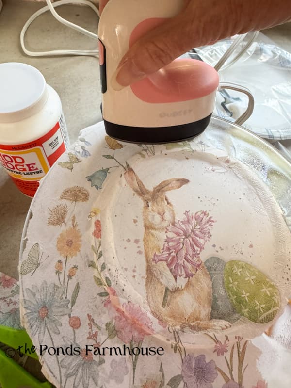 use heat press to adhere the napkin to backside of plate