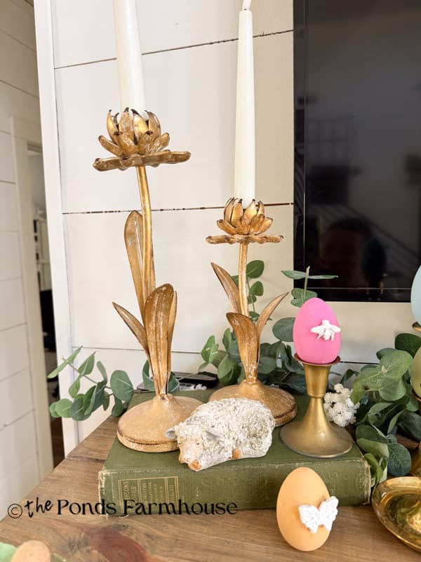 Metal flower candleholders with lamb and wooden Easter eggs