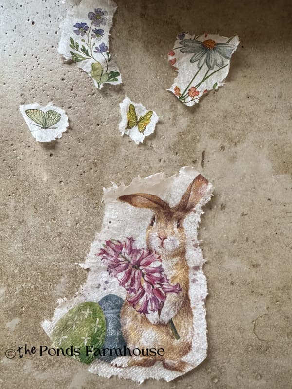 pieces of bunny napkin ready to apply to egg.