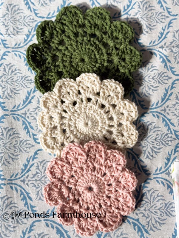 three easy DIY crochet doilies in pink, cream, green