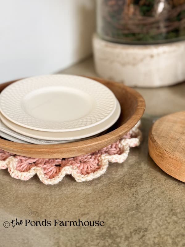 wooden bowel and ironstone dishes on crochet doily