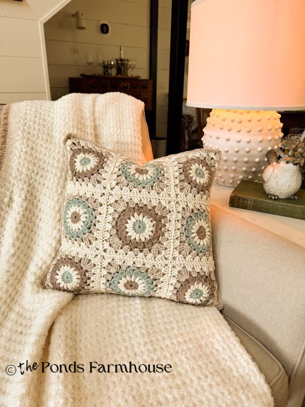 DIY Granny Square Pillow Cover on sofa