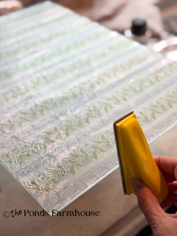 Sand edges of the board with finger sander to remove excess napkin and sealer
