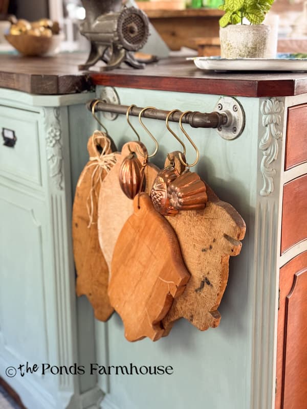 Vintage wood pig chopping boards handing on the kitchen island
