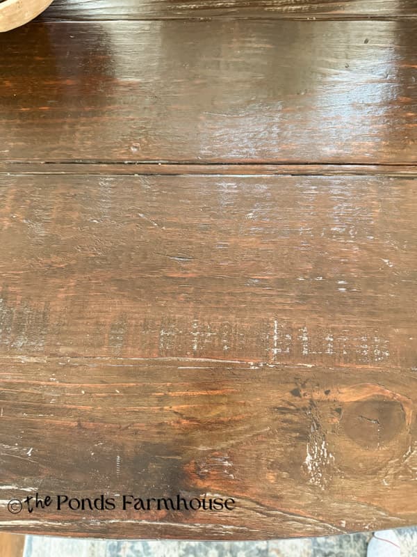 Wooden kitchen island top with distressed details to look like old barn wood