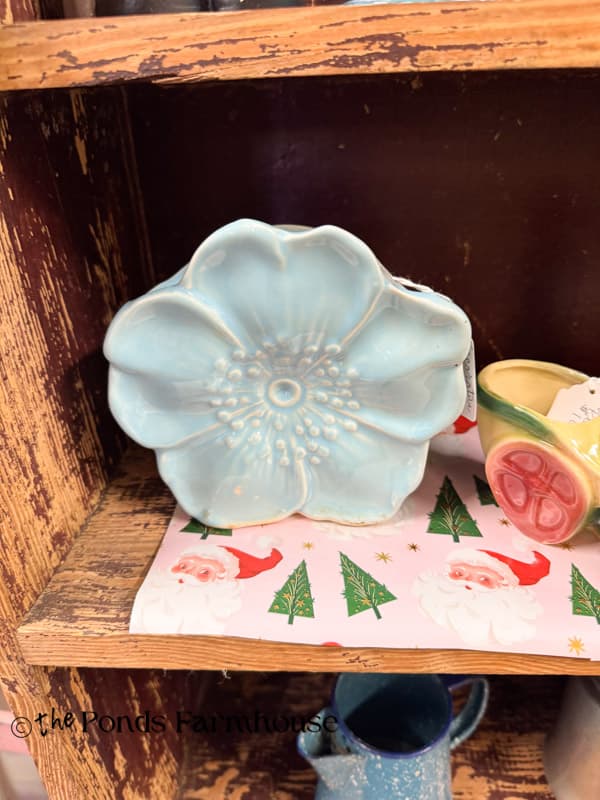 soft blue flower vase in thrift store