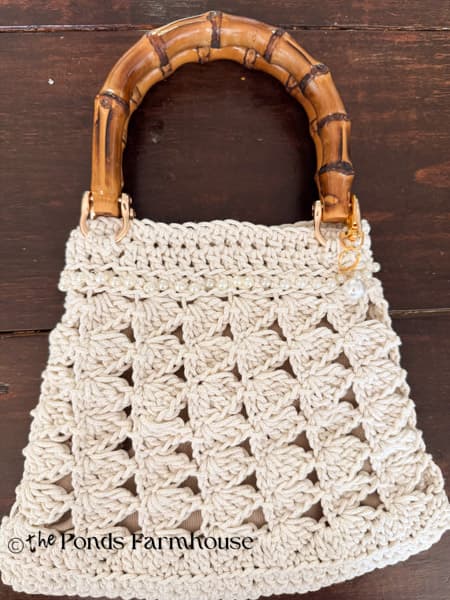 finished crochet purse with bamboo handles 