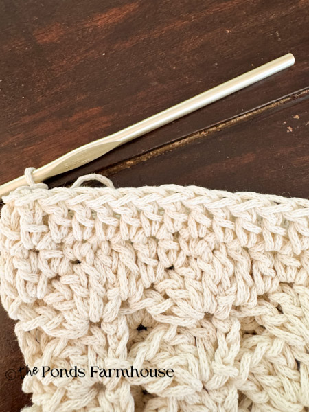 dc and hdc at bottom of crochet purse