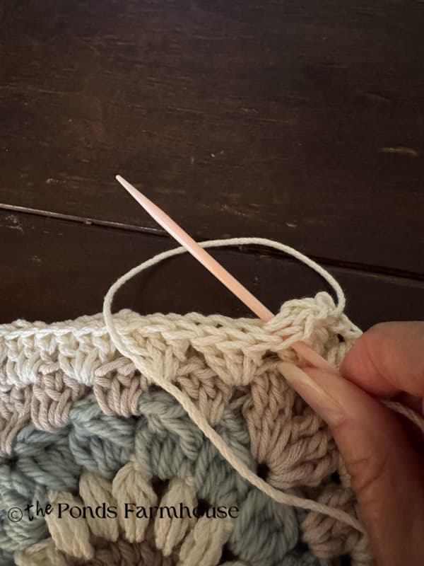 making a chain stitch to join the granny squares
