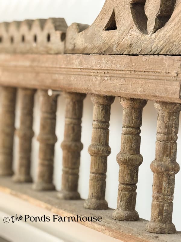antique porch fretwork salvaged and used over barn door