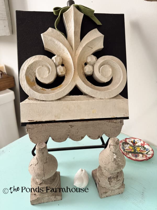 decorative antique salvage piece added to painted art canvas on easel
