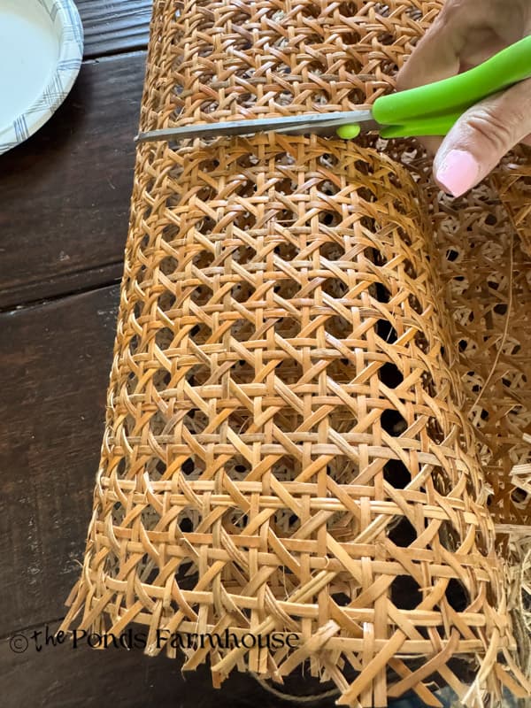 cut the cane webbing to fit around the glass vases