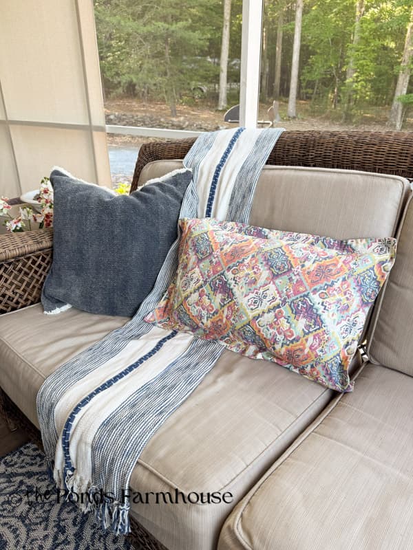 Colorful pillow slip cover inspired by Ballard Designs on porch couch