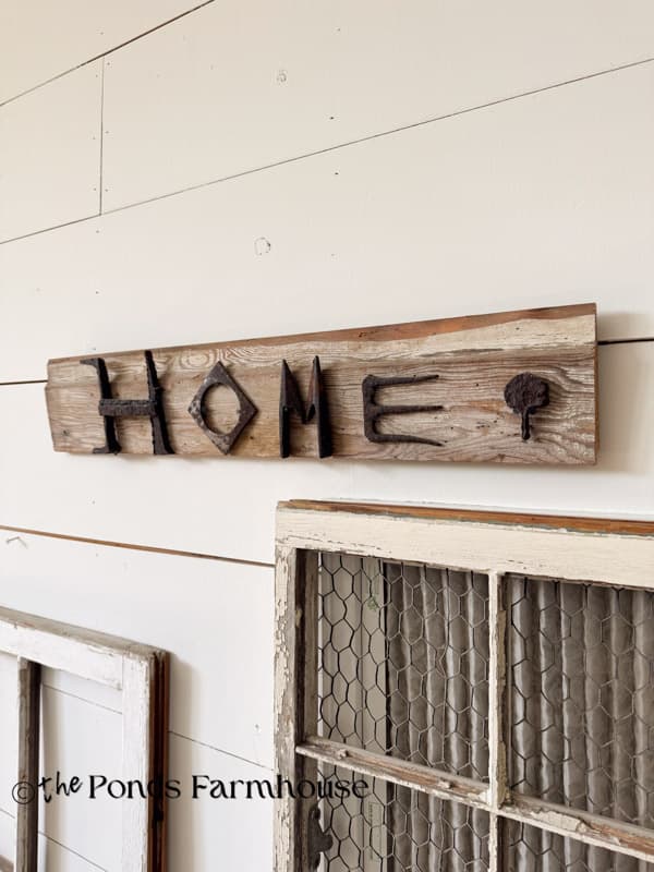 scrap iron salvaged & used to create a HOME sign for the gallery wall