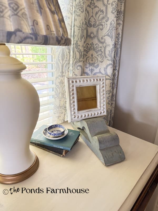 vintage corbel easel with DIY beaded mirror