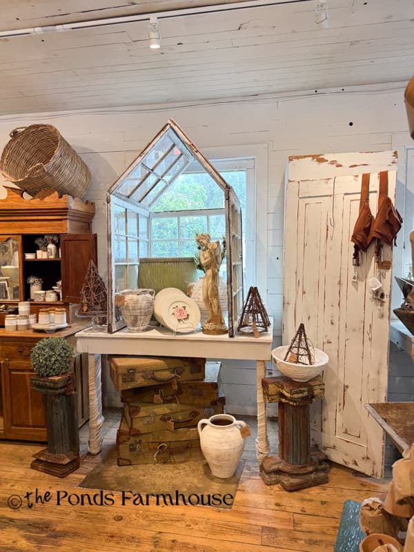 window terrarium at Ruffin's Roost display for Spring at the Farm Antique show.
