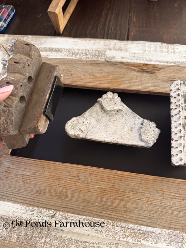 attach vintage wallpaper stamps with velcro to the cardboard
