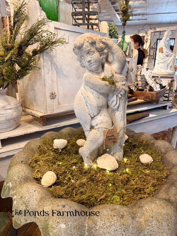 concrete cherub bird bath at Spring at the Farm pop-up show.