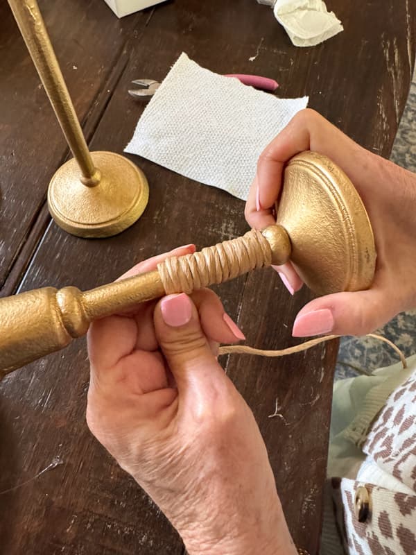 wrap vine wire around the candlestick holder tightly