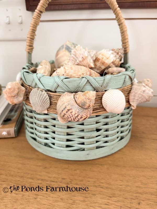 Upcycled Thrifted Basket filled with seashells. Paint and shell makeover