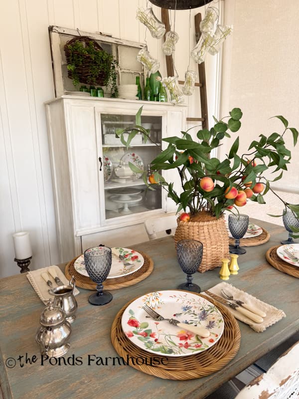 Easy Summer table with floral dishes and peach stem centerpiece