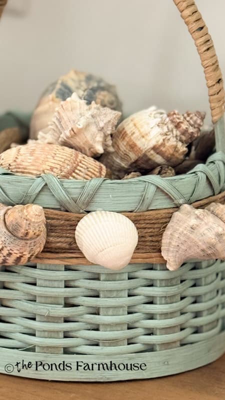 close up of DIY upcycled thrifted basket with seashells