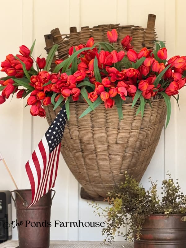 large vintage wall basket with faux red tulips & flags in copper vase
