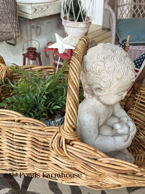 Gathering basket porch centerpiece with concrete baby & faux greenery 