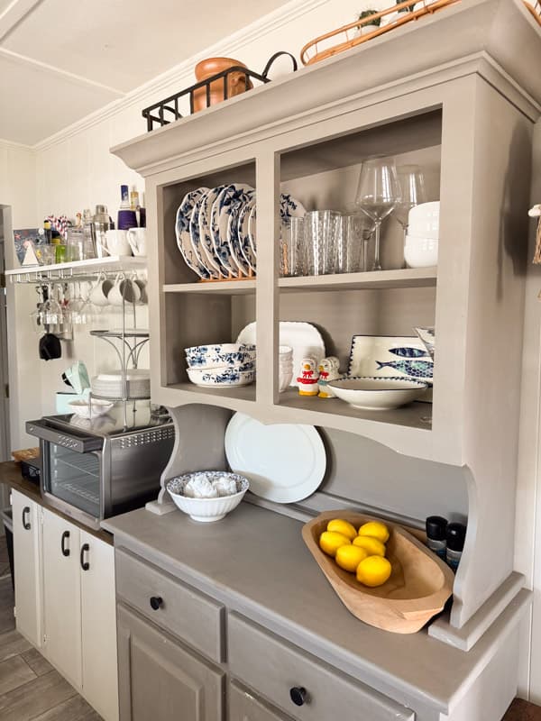 Kitchen cabinet and beverage bar in coastal cottage kitchen