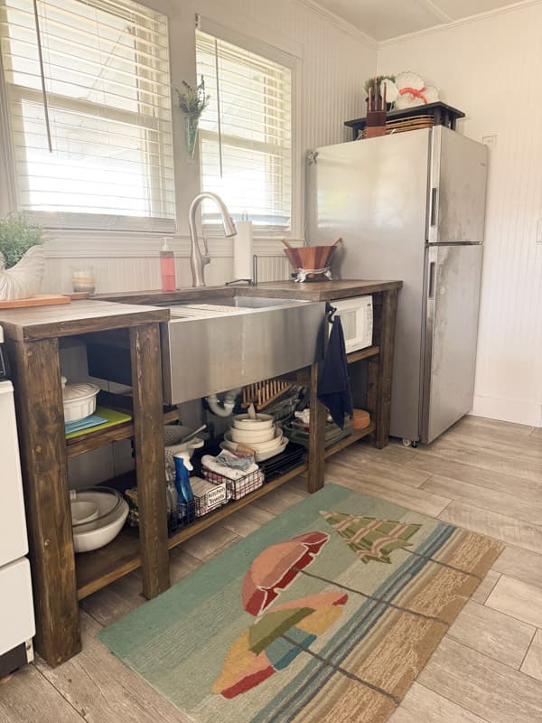 Open kitchen cabinets in the tiny beach cottage kitchen