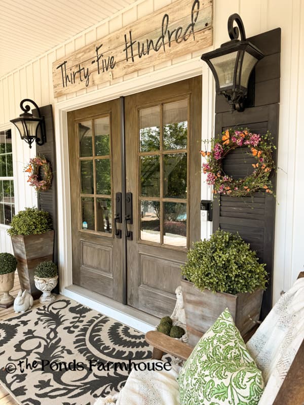 Summer Porch with DIY Butterfly wreaths and Faux Boxwoods in DIY planters