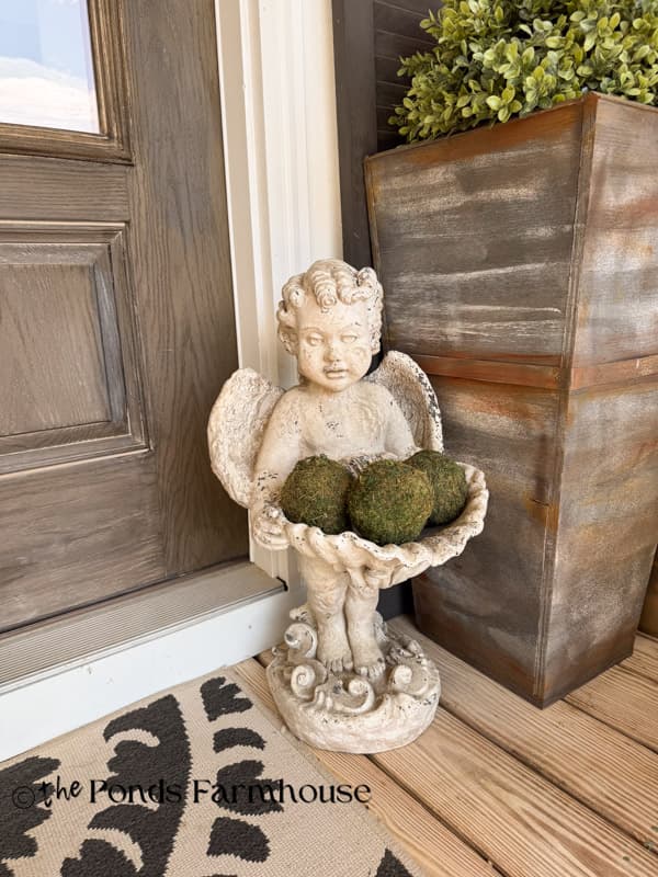Vintage Angel Statuary holding green moss balls