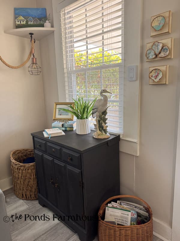 Beach cottage side table with coastal decor and art