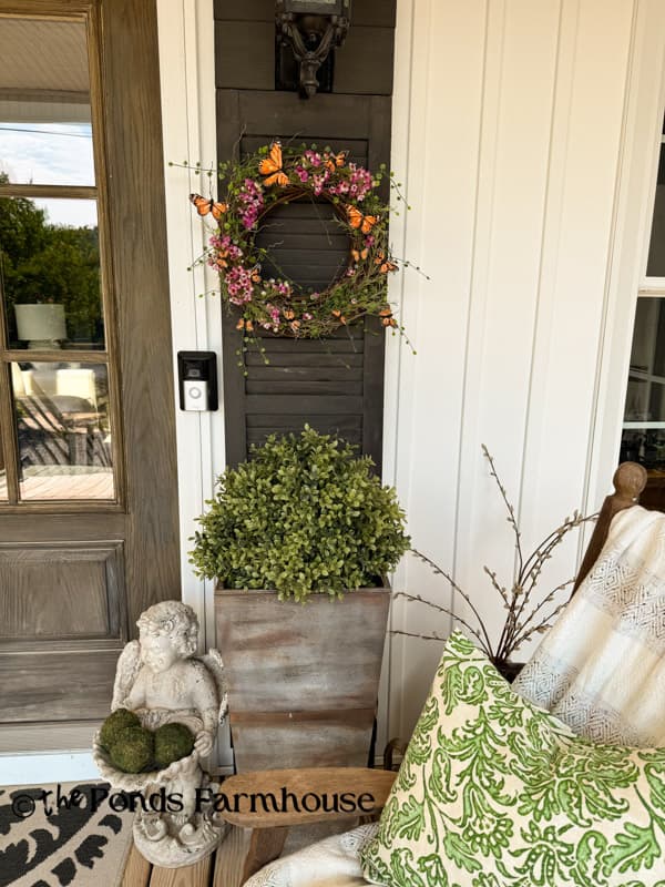 faux greenery and DIY Butterfly Wreath on Summer Porch