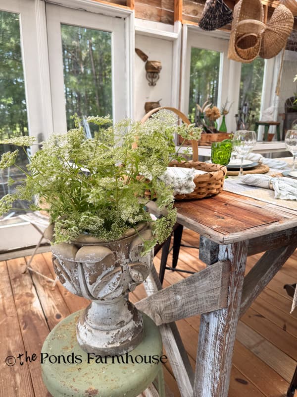  queen anne's lace arrangement at end of summer garden table in greenhouse  