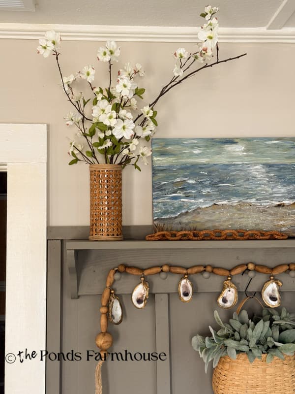 Serena & Lily Vase Dupe with dogwood stems on accent wall shelf in tiny beach cottage