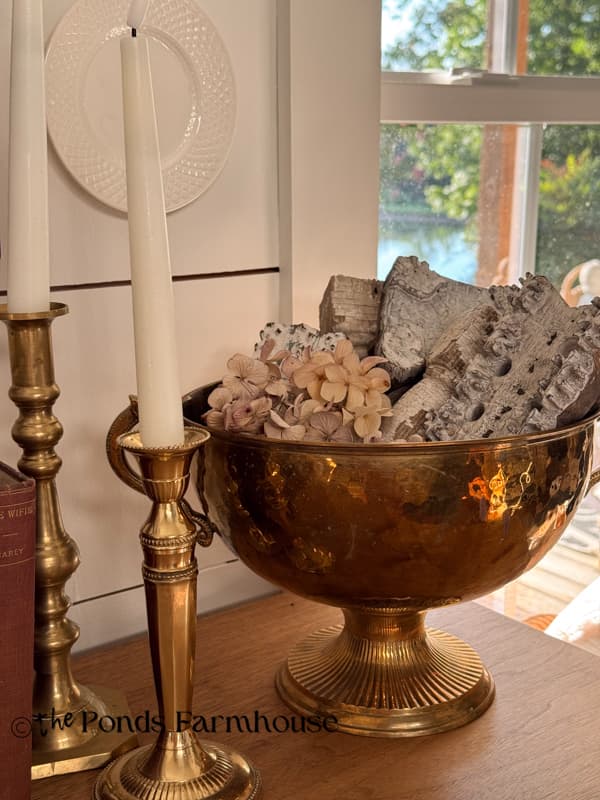 Brass Bowl with architectural elements & vintage brass candlesticks on entry table
