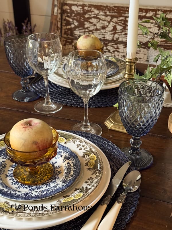 Early fall place setting with blues, browns, and gold vintage tableware