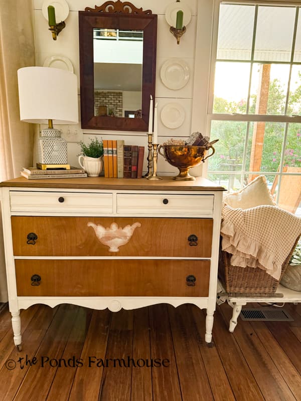 Entry Table with late summer/early fall decorations - Old books, vintage brass, mirror and basket with cozy linens
