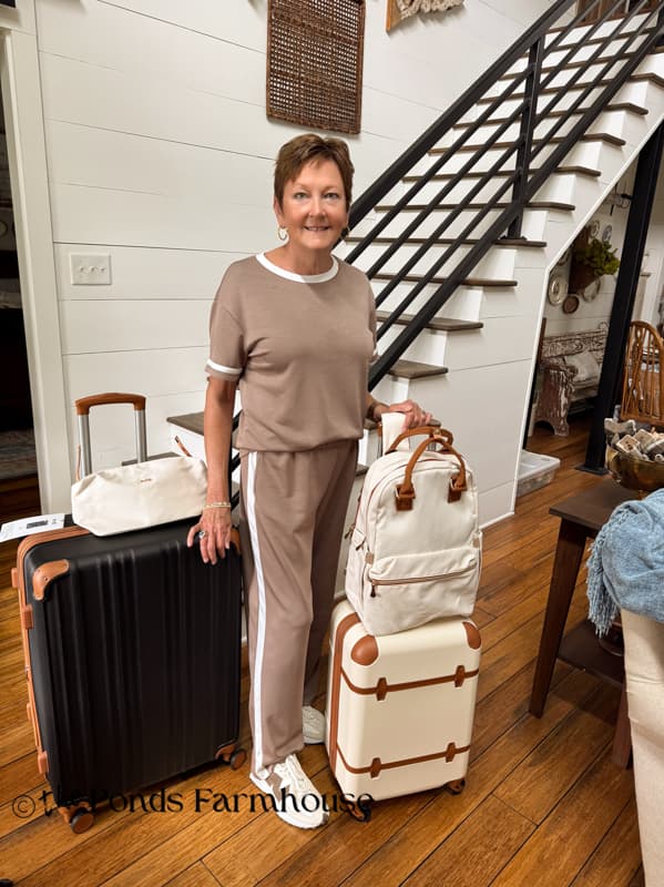 Rachel with travel wardrobe and luggage