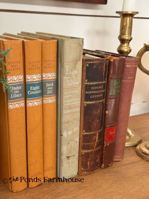 Fall colored vintage books on entry table