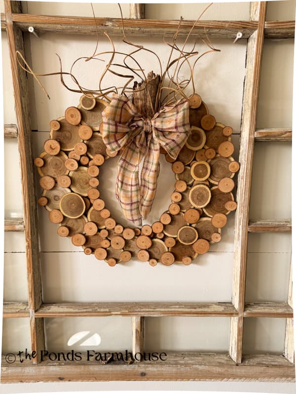 DIY Wood Slice Pumpkin Wreath on old window
