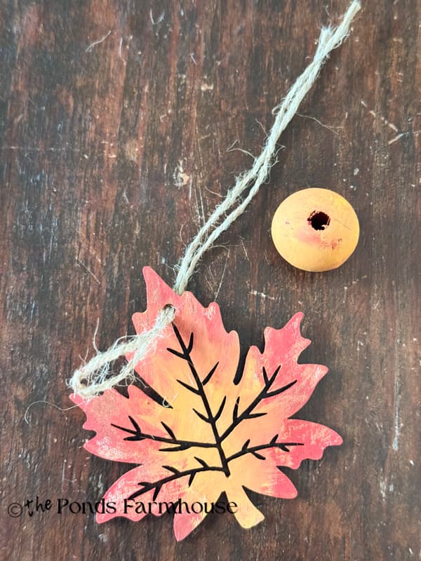 added painted wood leaf and bead to jute twine