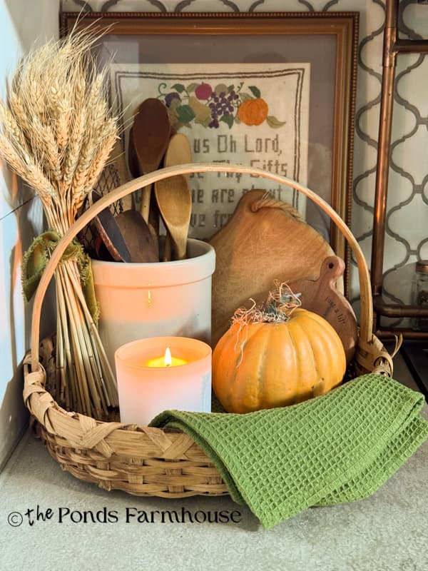 Basket tray with, wheat stems, pumpkin, crock & Vintage wooden spoons & cuttiing boards