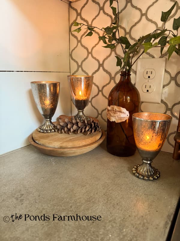 DIY Mercury Glass Votive Candle Holders from upcycled glassware.
