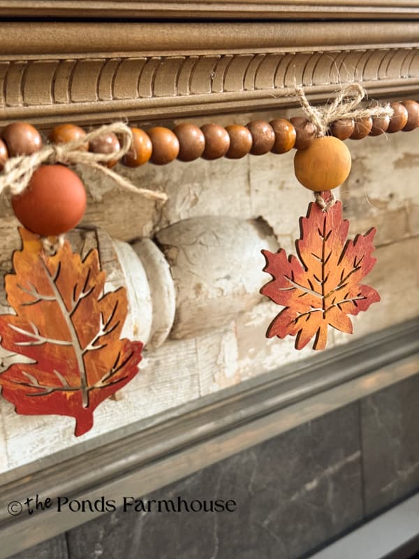 DIY Wooden Leaf Garland with beads on mantel